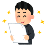 テストを見て笑う男子.png